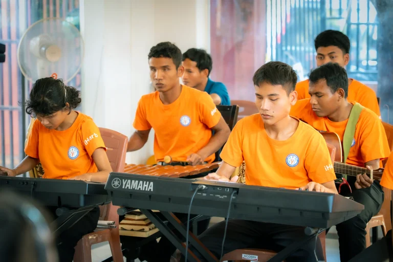 Students with visual impairments participating in group music training at the DYP Learning Center in Cambodia