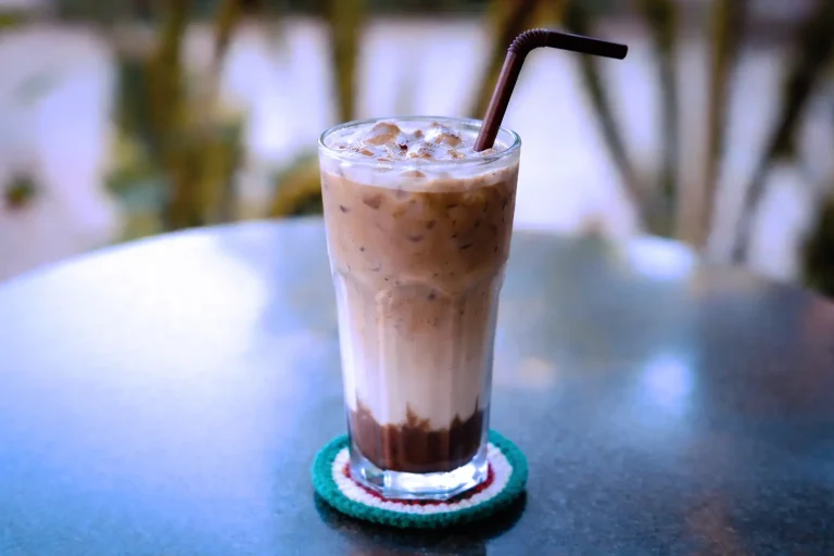 Iced mocha latte with chocolate, milk, and espresso served in a tall glass at the DYP Inclusive Café in Siem Reap.
