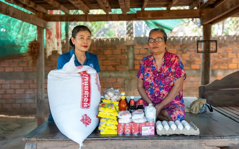 DYP Cambodia staff providing food support package to a woman through the Direct Assistance Program
