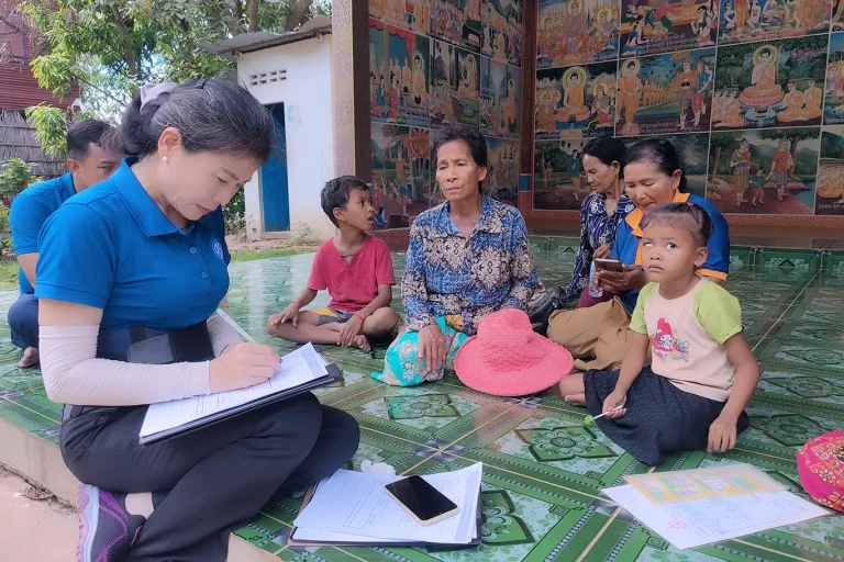 DYP staff conducting household research visit with family in rural Siem Reap Cambodia
